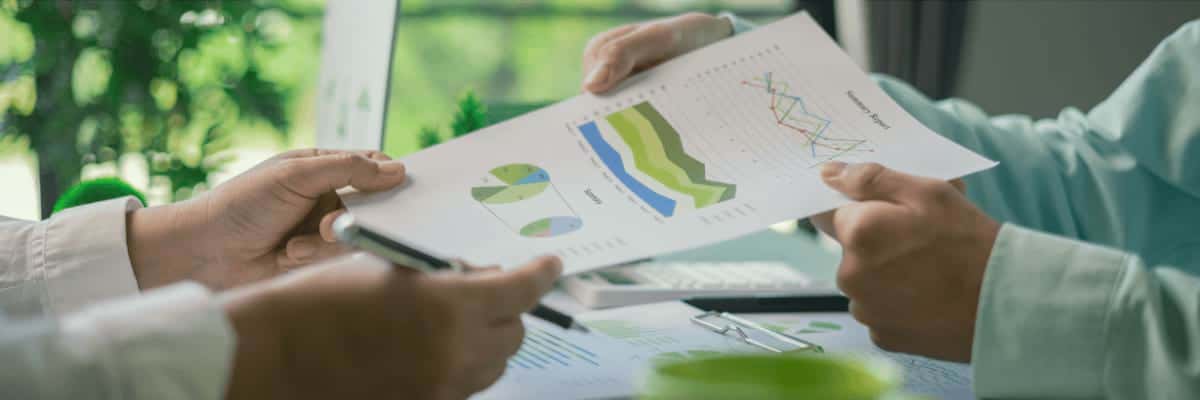 Business people reviewing sustainability data