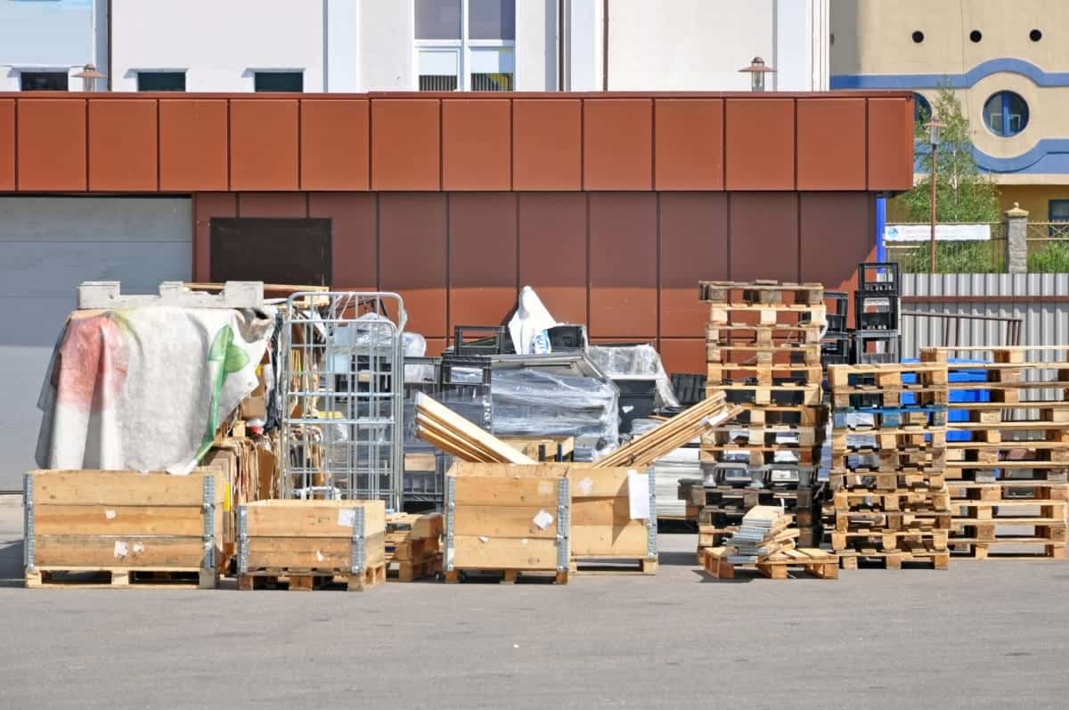 Retail store unloading zone with pallets and store fixtures
